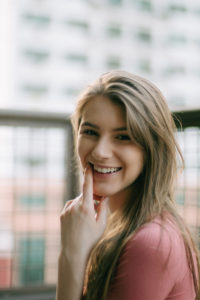 Girl pointing to tooth